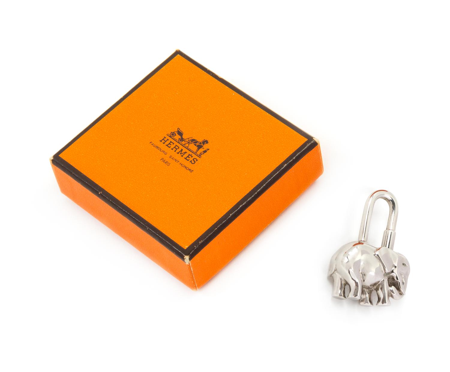 An Hermès Palladium Cadena Elephant Lock Charm, 1" x 1.5".
