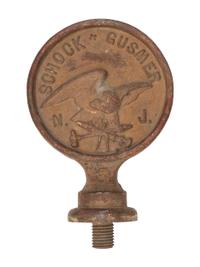 A Pair of Cast Iron Kettle Toppers and Two Trivets