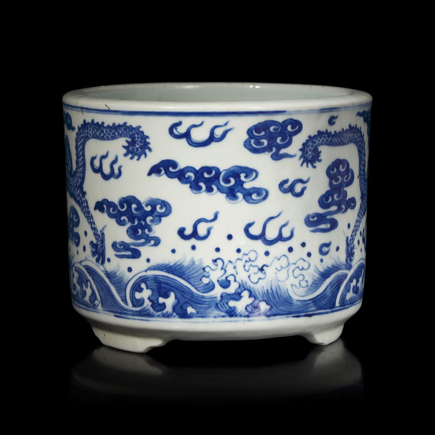 A Chinese Blue and White "Dragons" Tripod Porcelain Censer, Qing Dynasty — 清 青花云龍紋三足爐