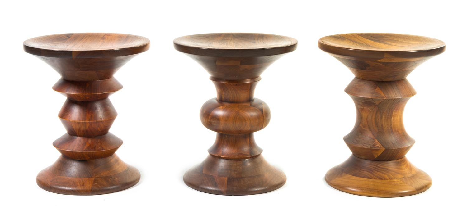 A Group of Three Charles and Ray Eames for Herman Miller Time-Life Walnut Stools Height 14 1/2 x width 13 inches.