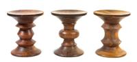 A Group of Three Charles and Ray Eames for Herman Miller Time-Life Walnut Stools Height 14 1/2 x width 13 inches.
