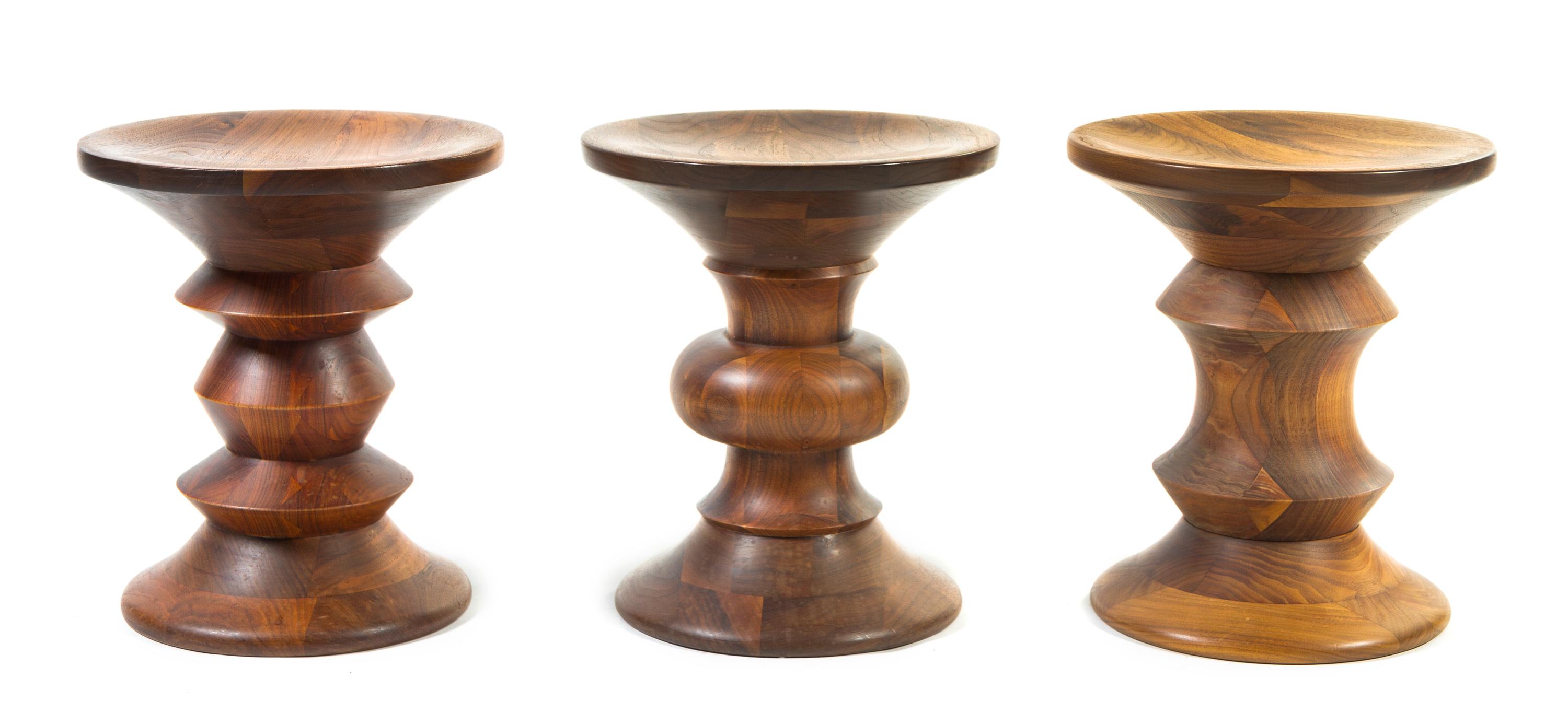 A Group of Three Charles and Ray Eames for Herman Miller Time-Life Walnut Stools Height 14 1/2 x width 13 inches.