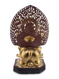 A Gilt and Red Lacquered Bronze Figure of a Multi-Armed Deity