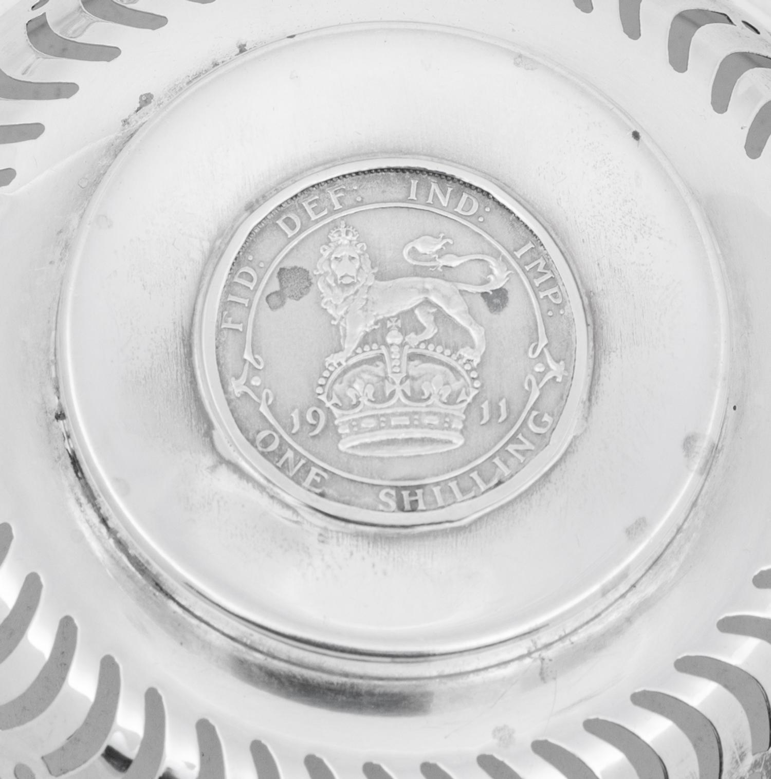 A Set of Four English Silver Coin-Inset Nut Dishes