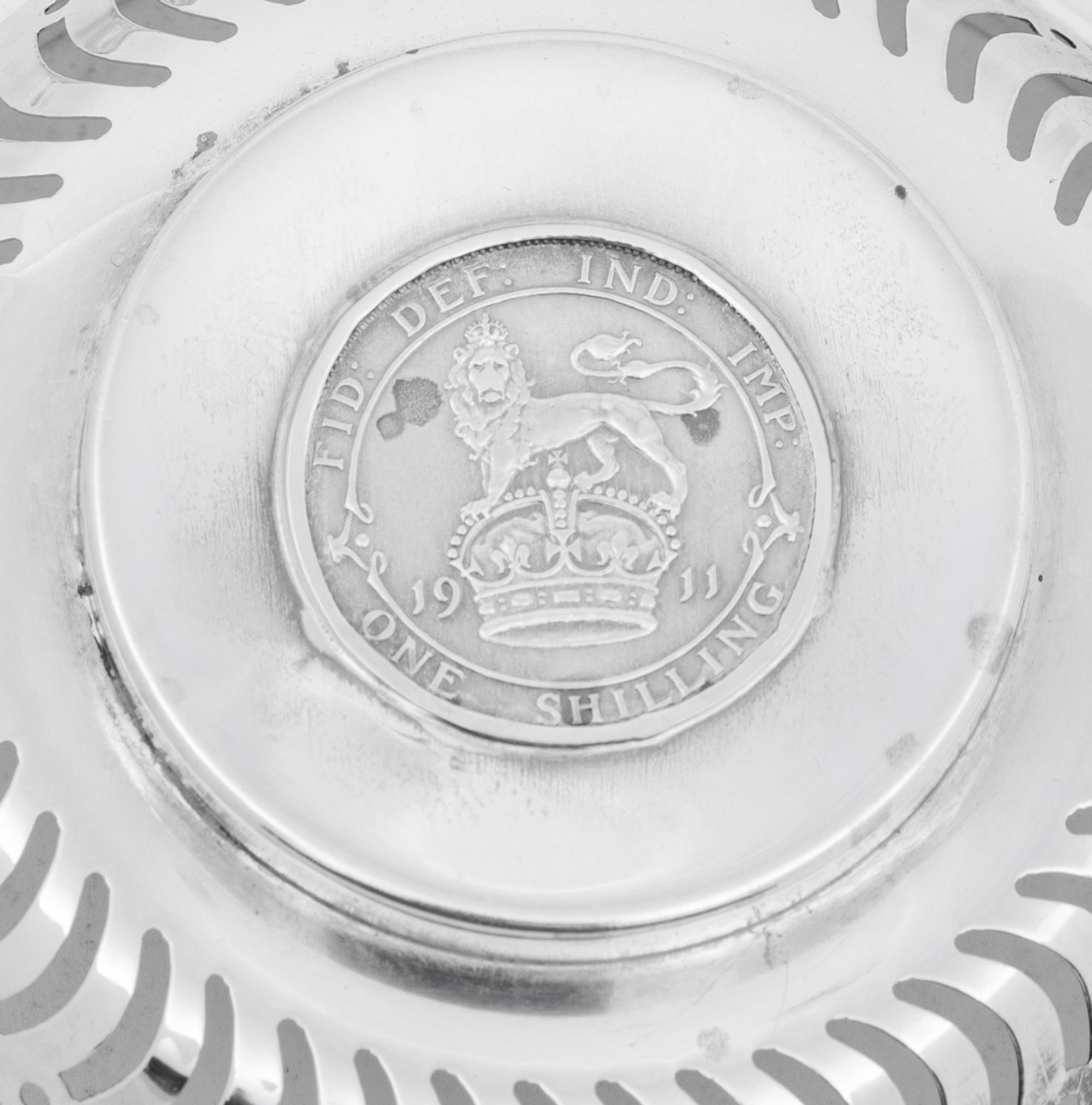 A Set of Four English Silver Coin-Inset Nut Dishes