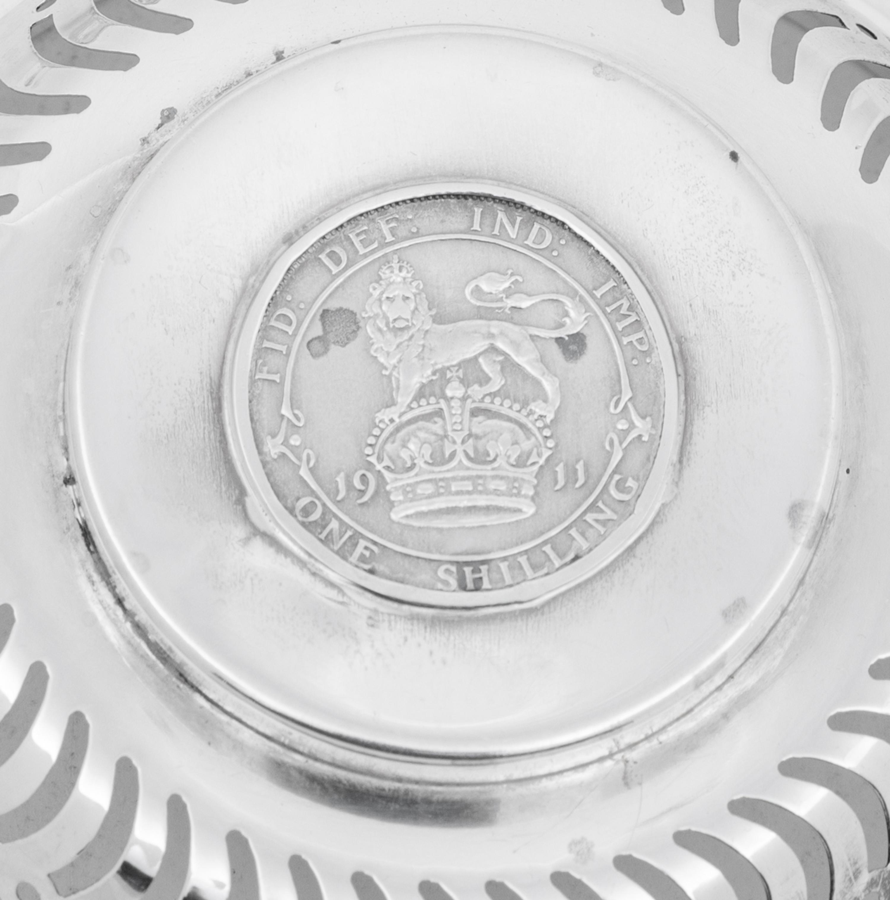 A Set of Four English Silver Coin-Inset Nut Dishes