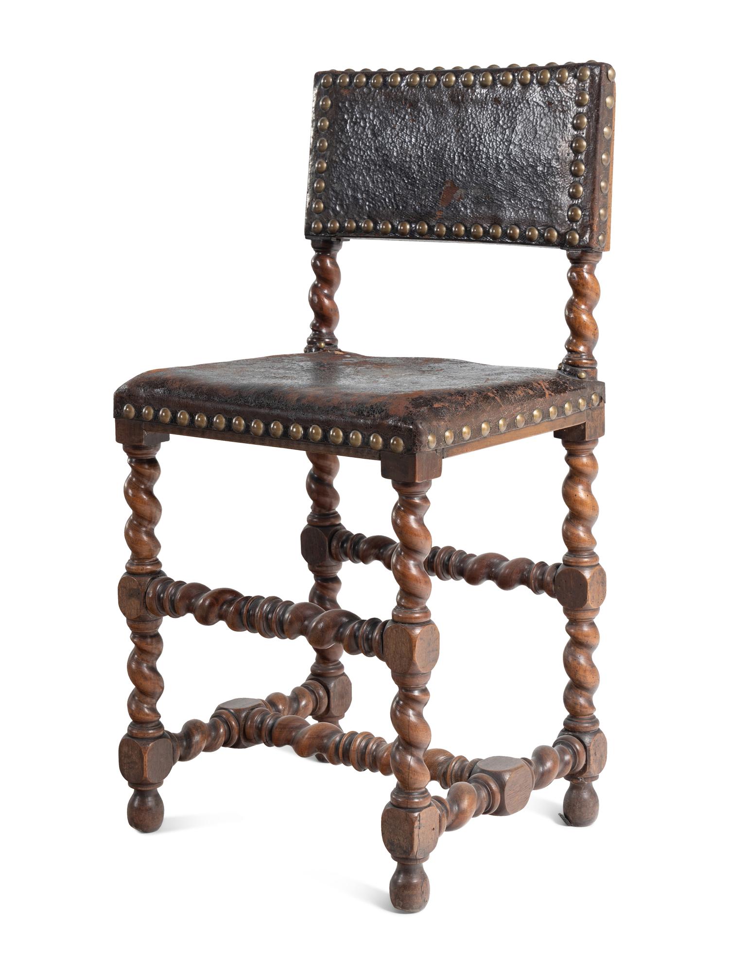 A Set of Six Spanish Baroque Style Walnut Dining Chairs