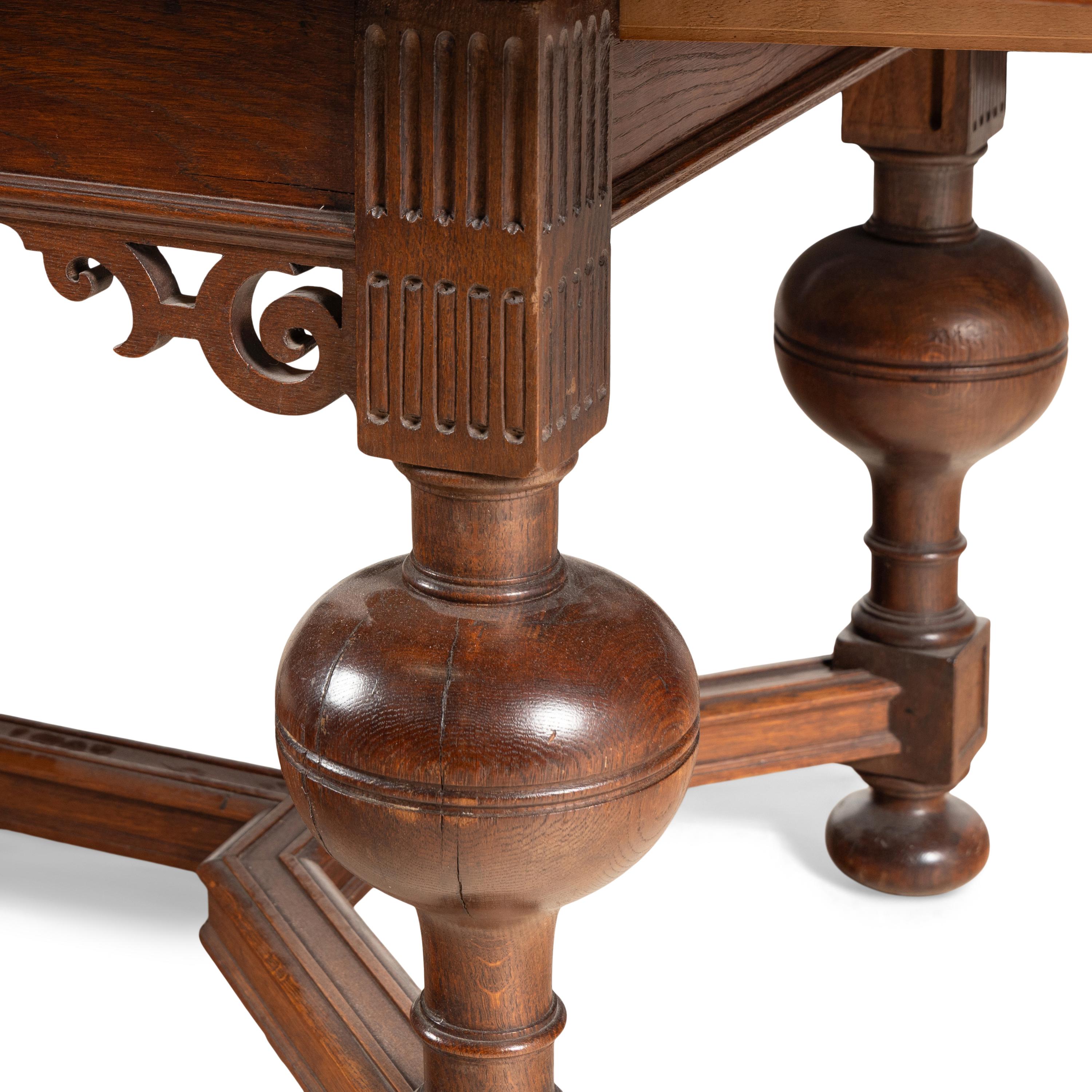 A Baroque Style Oak Draw-Leaf Dining Table