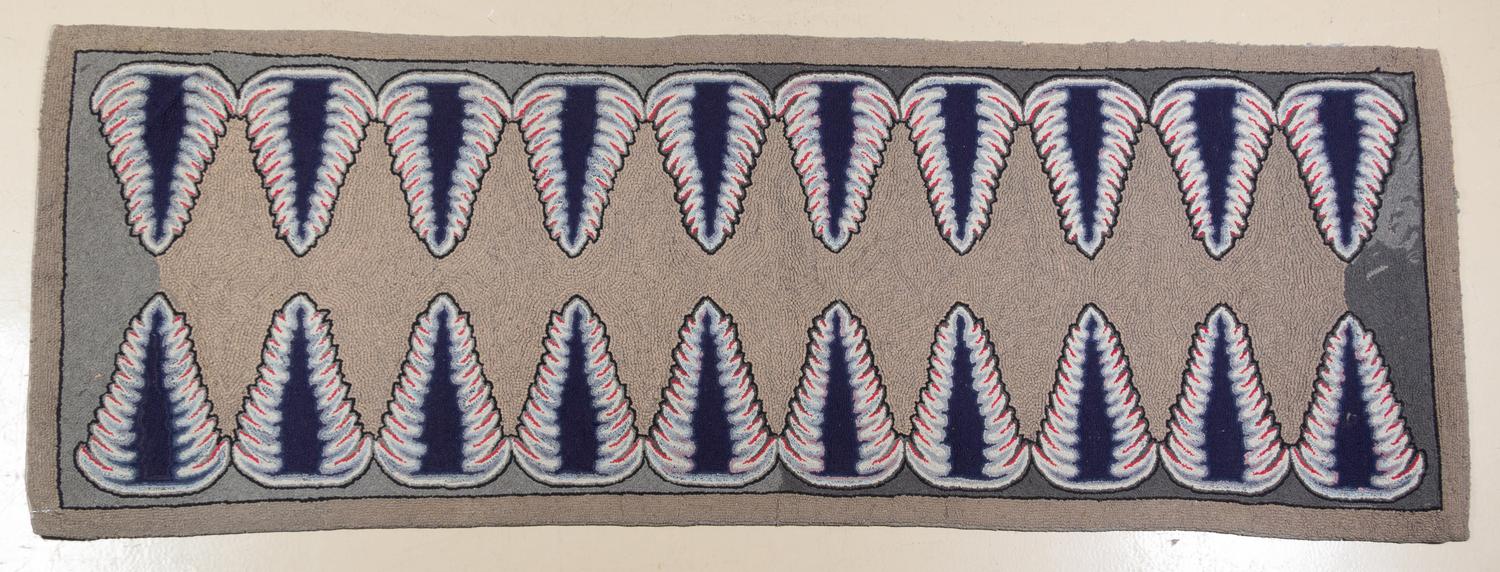 An American Hooked Rug 8 feet 9 inches x 3 feet 2 inches.