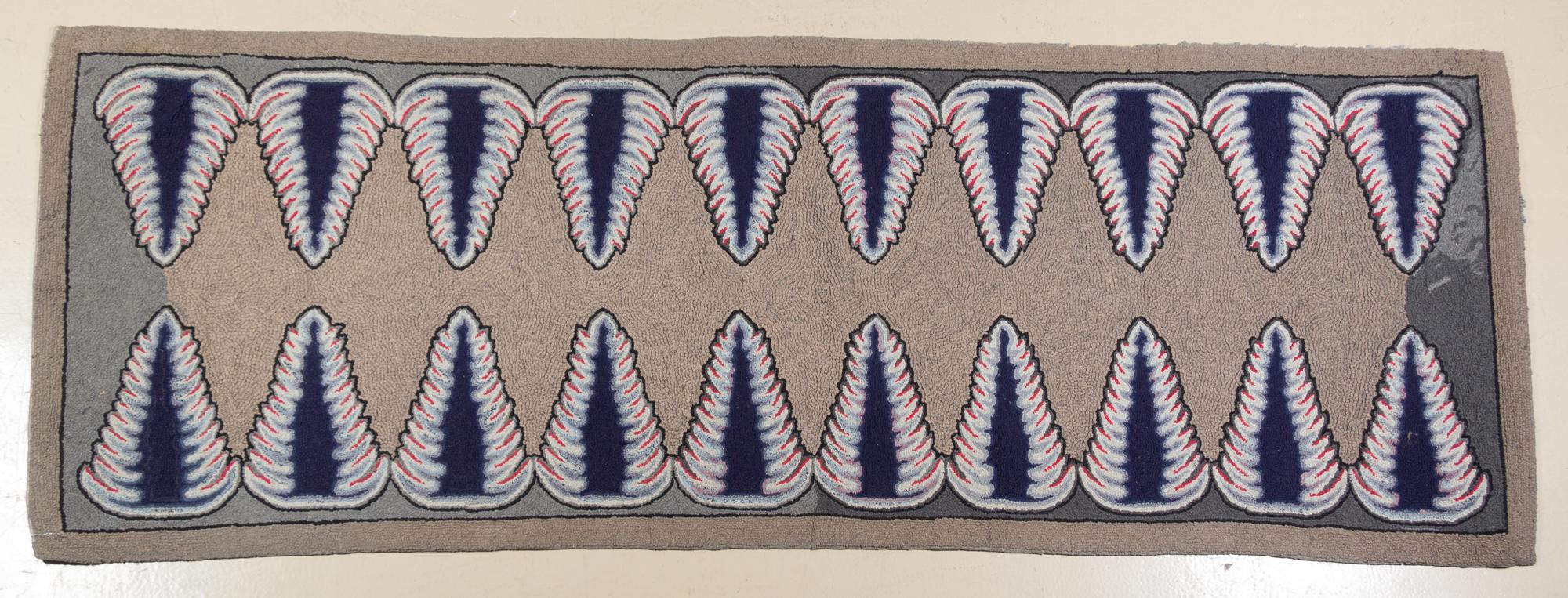 An American Hooked Rug 8 feet 9 inches x 3 feet 2 inches.