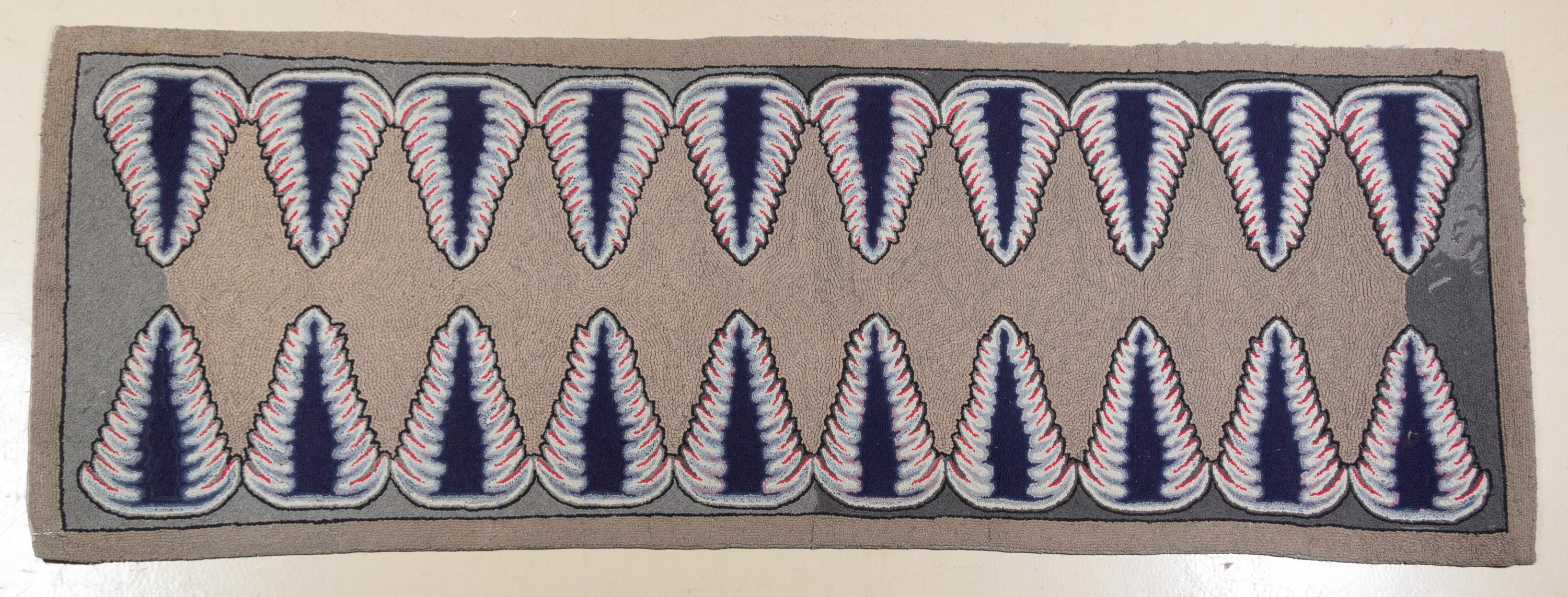An American Hooked Rug 8 feet 9 inches x 3 feet 2 inches.