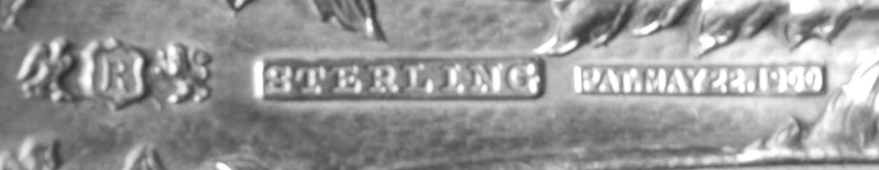 An American Silver Flatware Service, Reed and Barton, Taunton, MA, Les Cinq Fleurs pattern, comprising: 8 dinner knives 6 luncheon kniv
