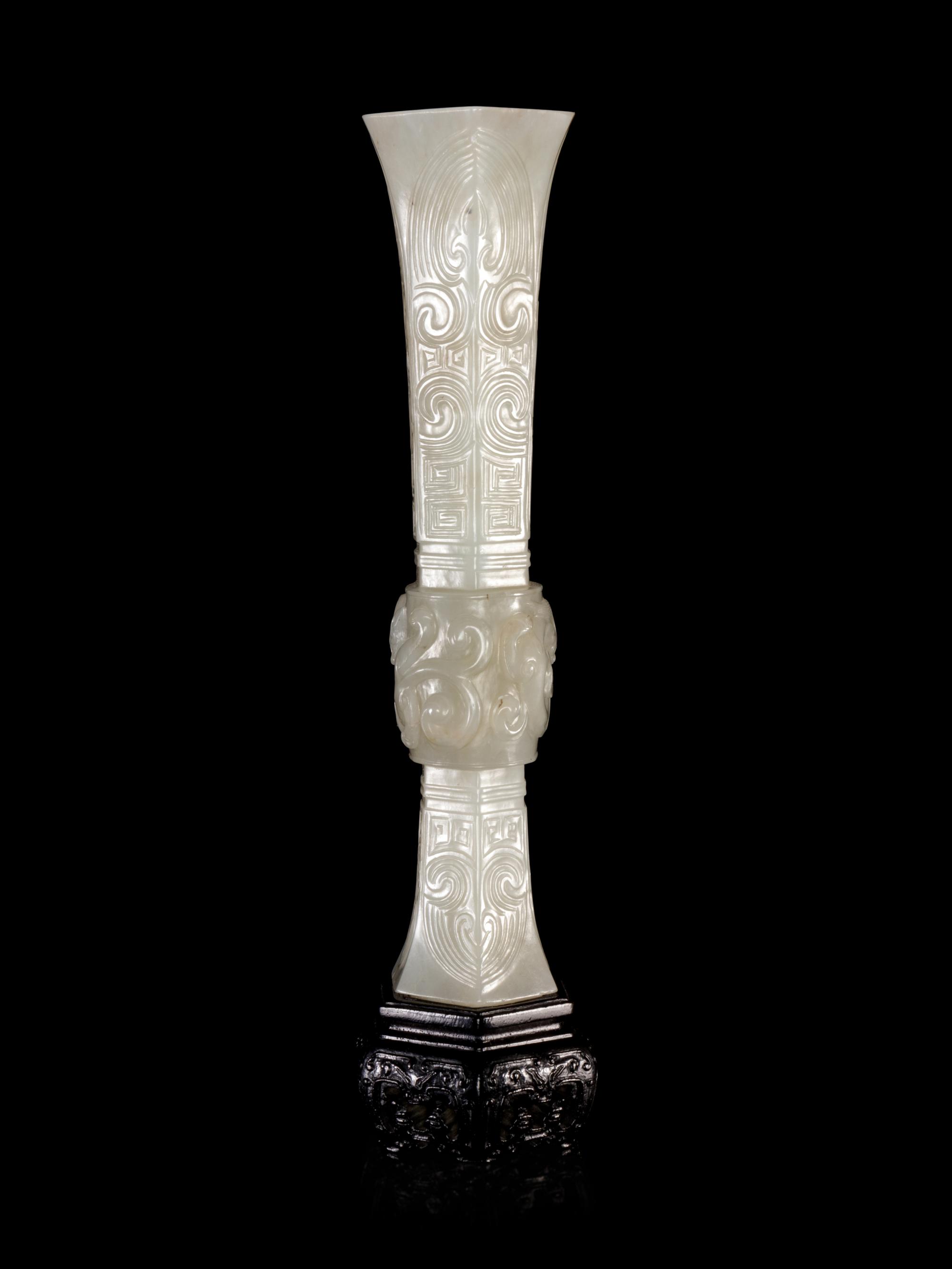 A Carved White Jade Gu Vase