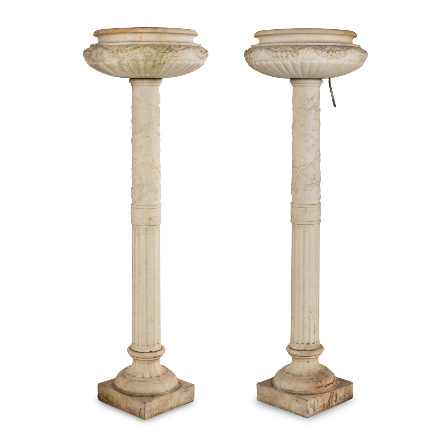 A Pair of Carved Marble Jardinières on Pedestals