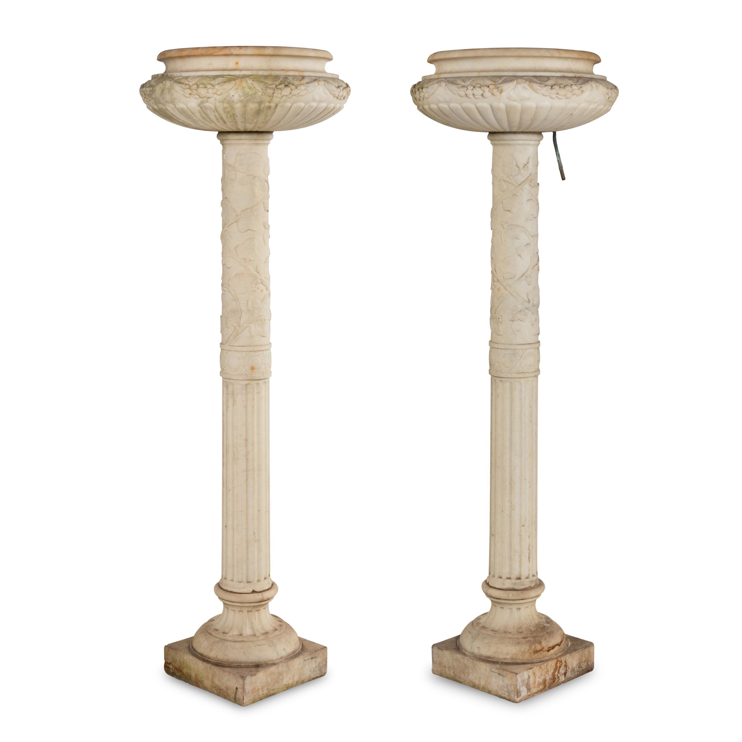 A Pair of Carved Marble Jardinières on Pedestals