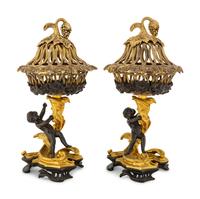 A Pair of Continental Rococo Style Parcel Gilt Bronze Figural Fruit Baskets