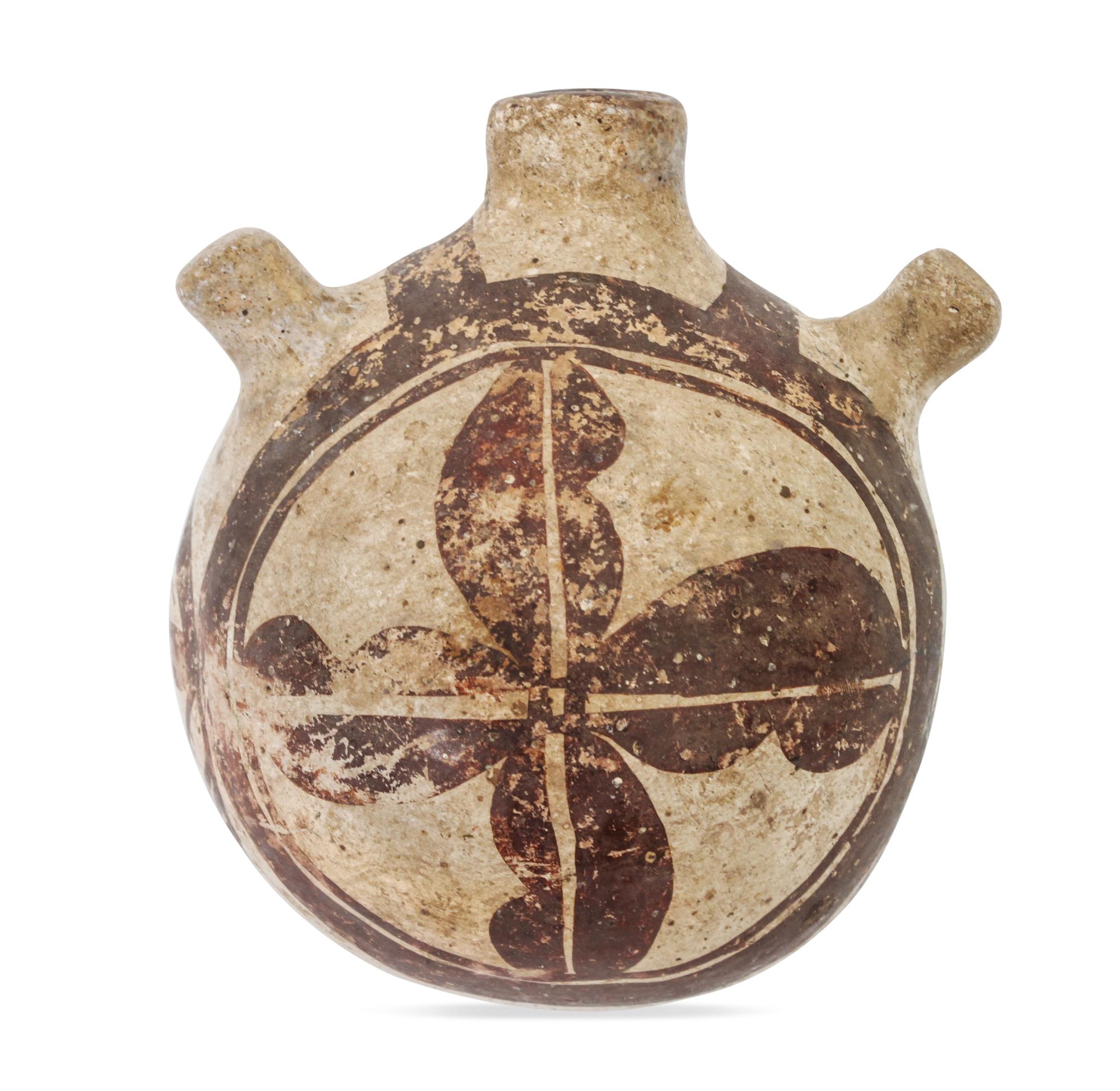 An Acoma Canteen Height 3 1/2 x diameter 3 1/2 inches.