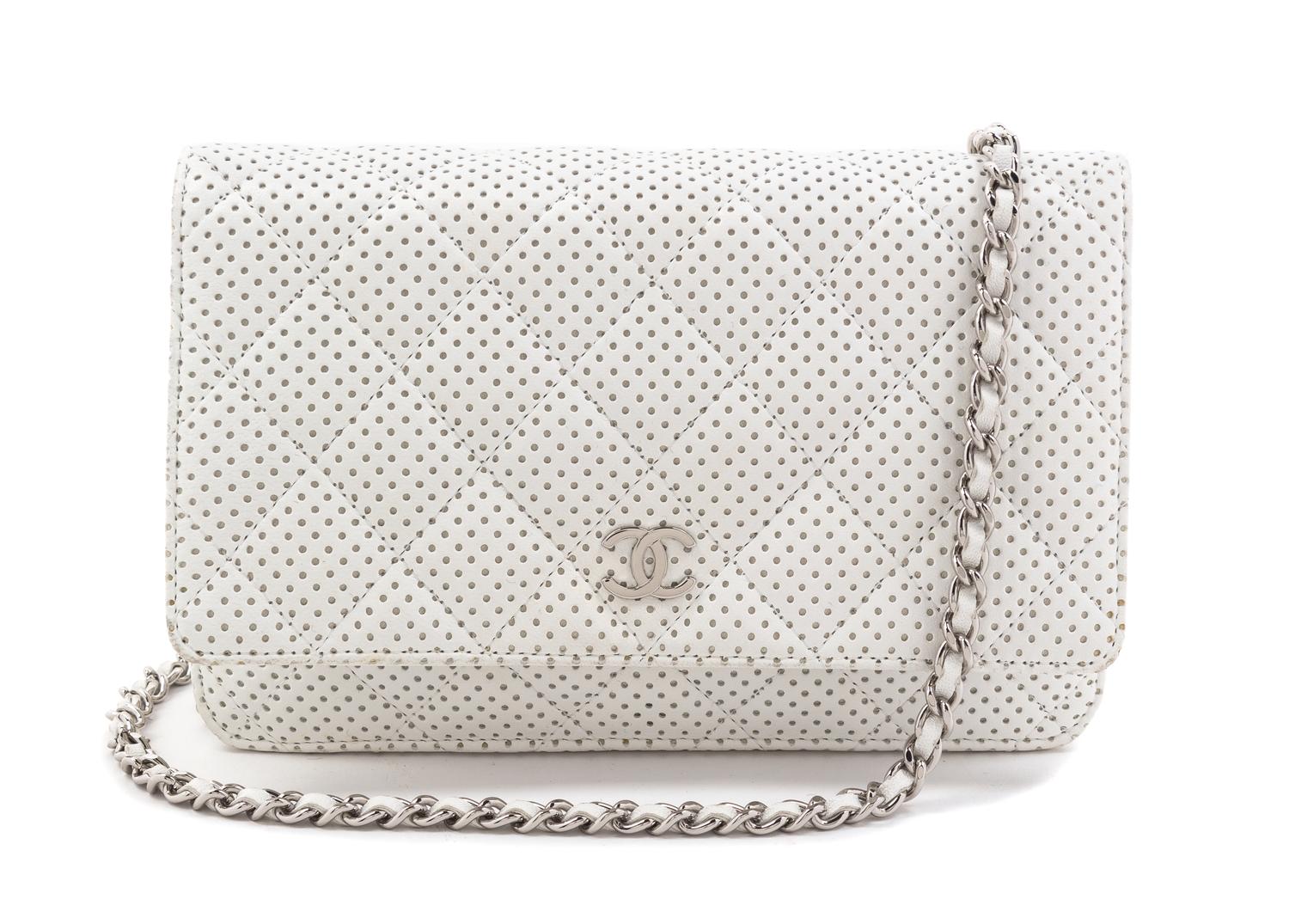 A Chanel White Dot Flap Handbag, 7.5" x 5" x 1".