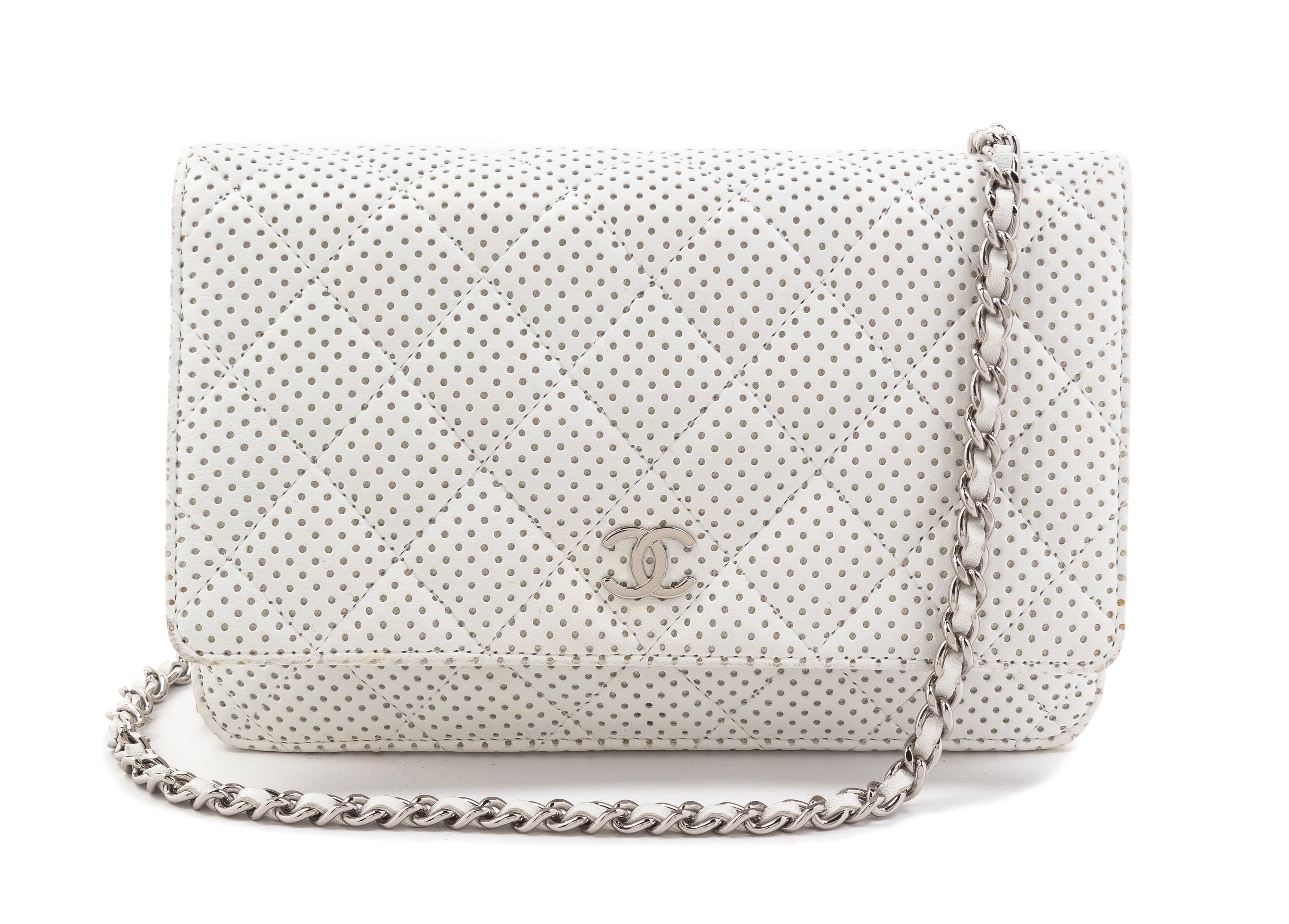 A Chanel White Dot Flap Handbag, 7.5" x 5" x 1".