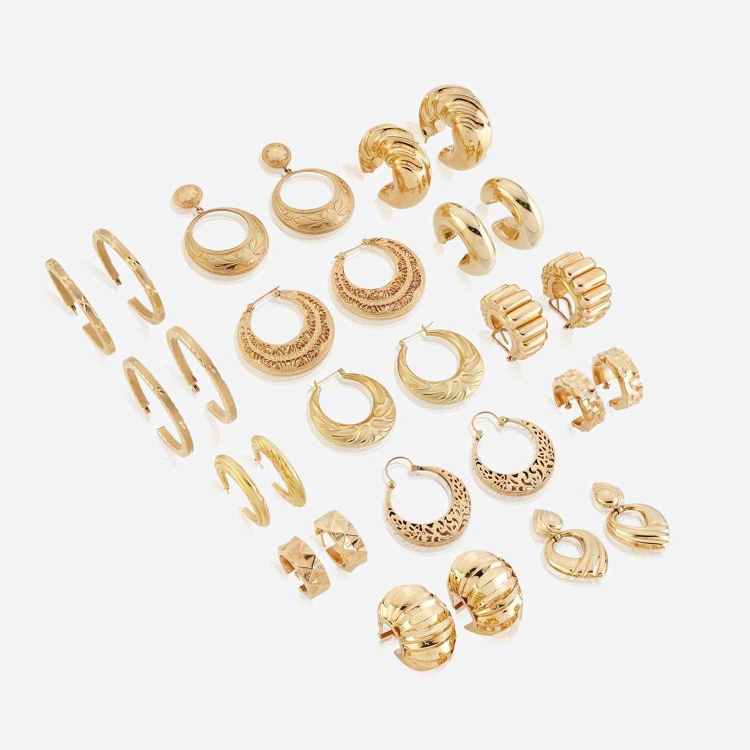 A collection of fourteen pairs of fourteen karat gold earrings