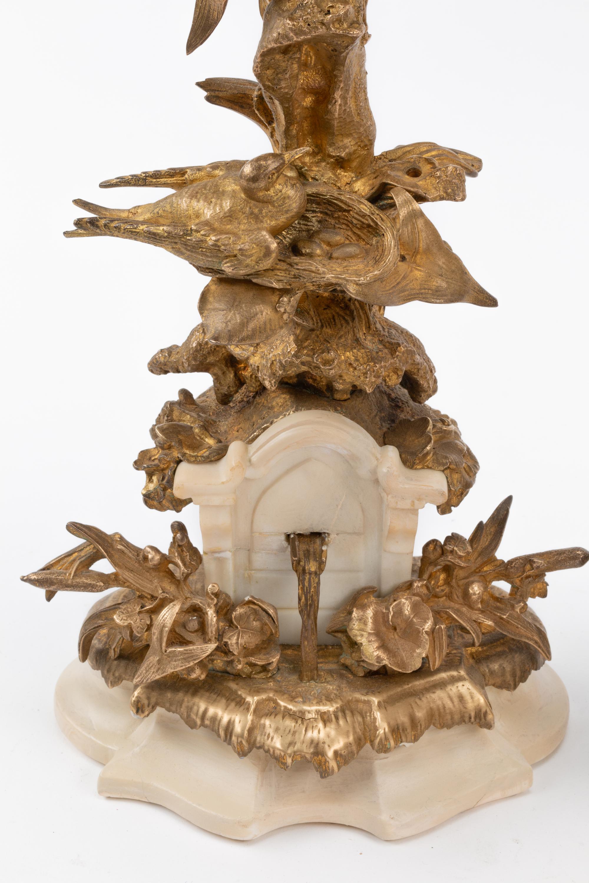 A Pair of Napoleon III Silvered Bronze and Marble Candlesticks