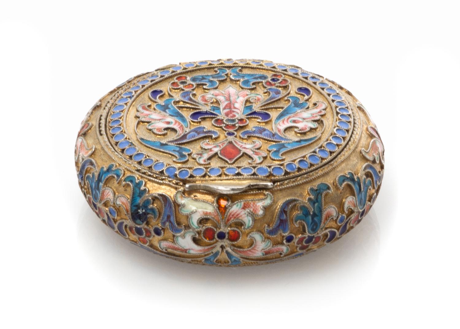 A Russian Silver and Enamel Snuff Box, Mark of Ivan Saltykov, Moscow, late 19th century, of circular form, having a gilt wash ground wi
