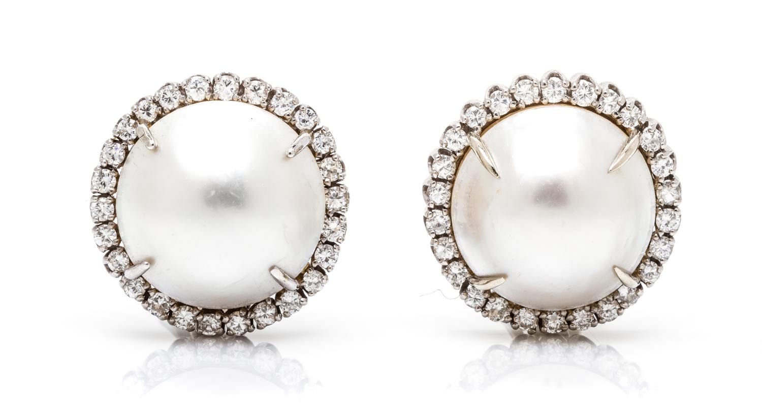 A Pair of White Gold, Cultured Mabe Pearl and Diamond Earclips, 9.70 dwts.