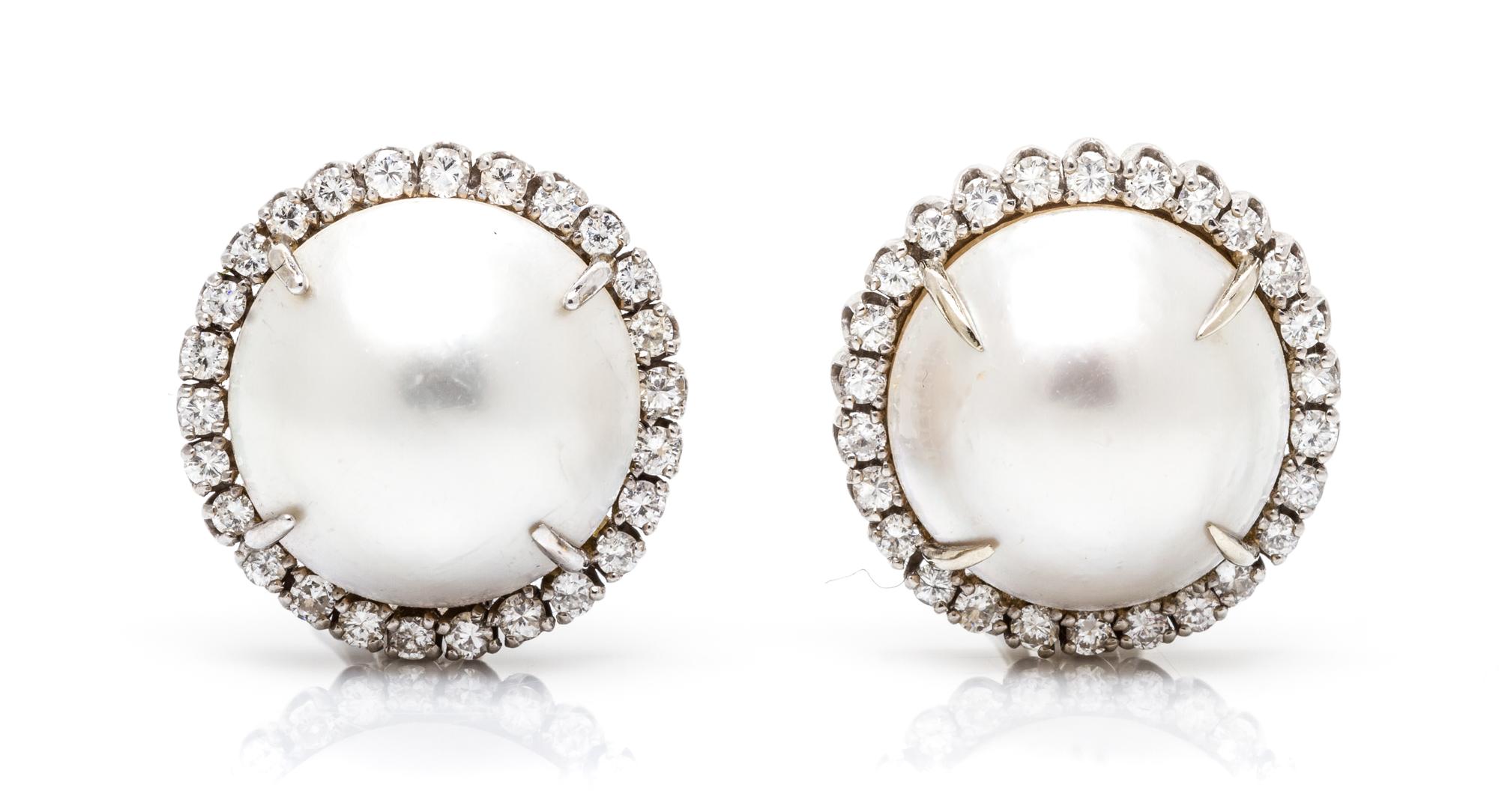 A Pair of White Gold, Cultured Mabe Pearl and Diamond Earclips, 9.70 dwts.