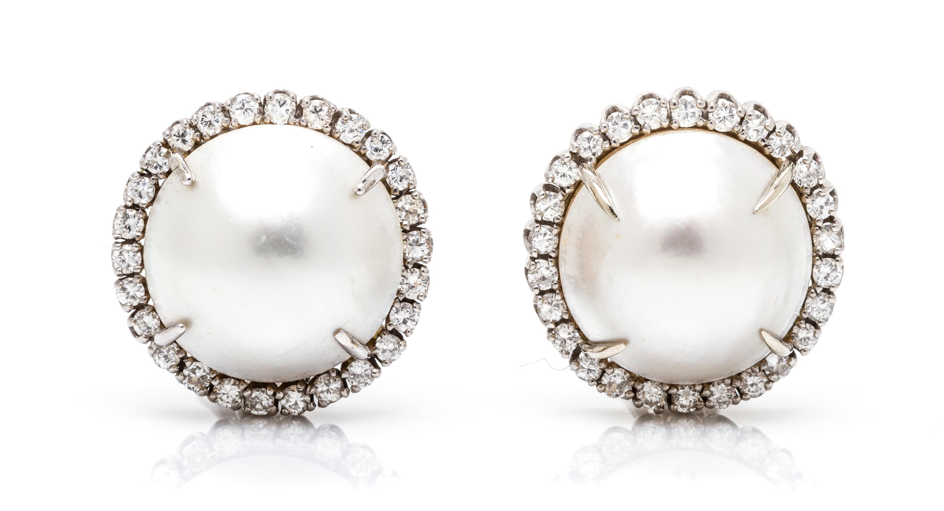 A Pair of White Gold, Cultured Mabe Pearl and Diamond Earclips, 9.70 dwts.