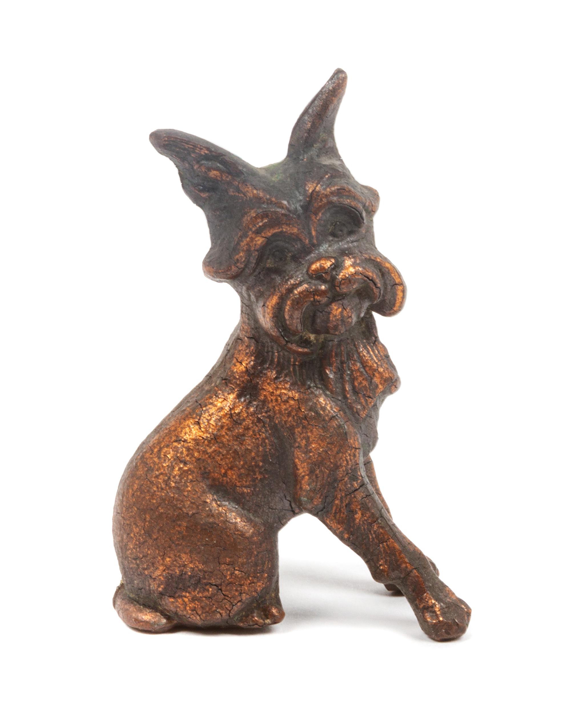 A Painted Metal Brussels Griffon Figure Height 3 1/8 inches.