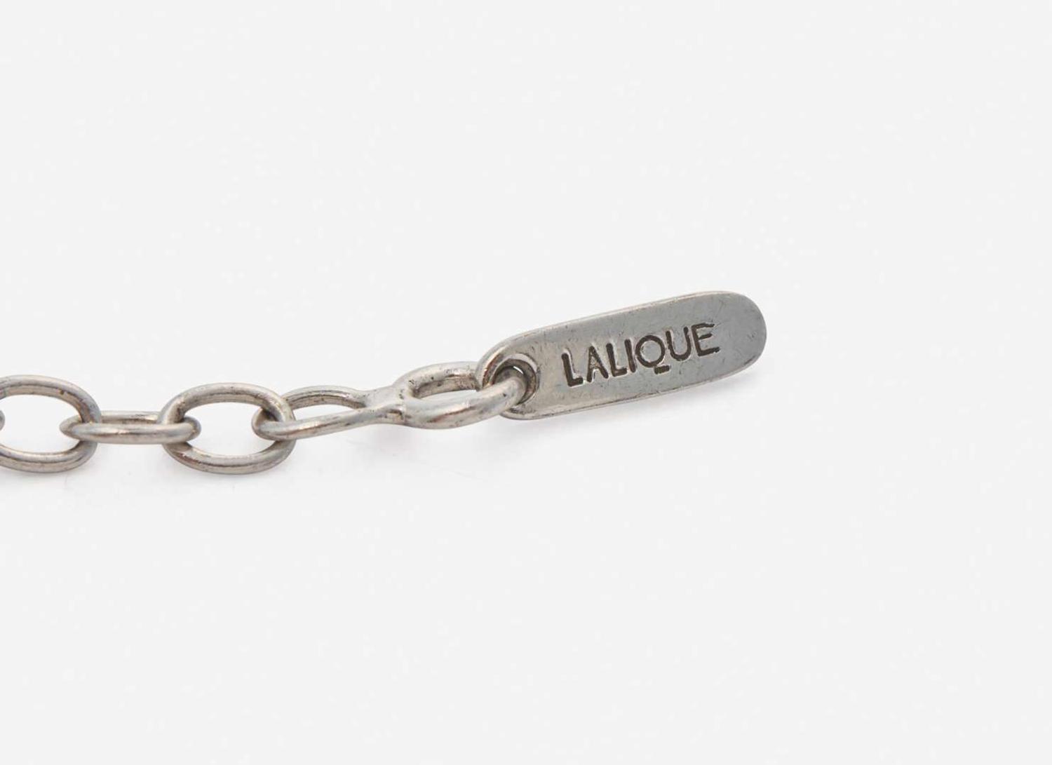 A Platinum and Diamond Tiffany & Co. Petals Key Pendant on a Sterling Silver Lalique Cord