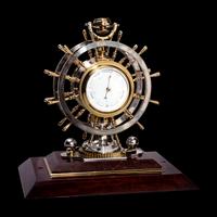 An English Steel and Brass Ship's Wheel Clock and Barometer, E&E Emanuel