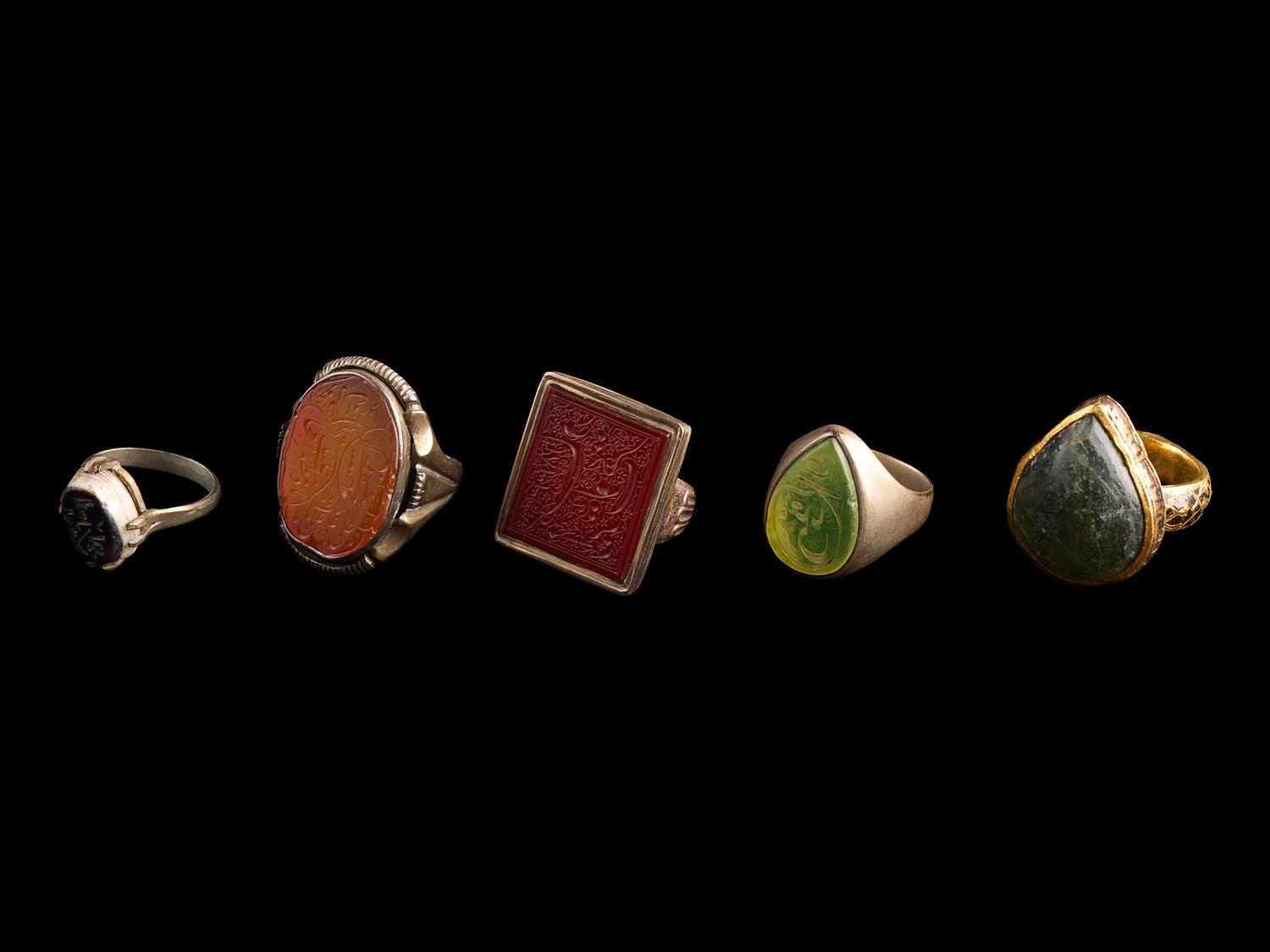A Group of Five Islamic Stone and Metal Finger Rings