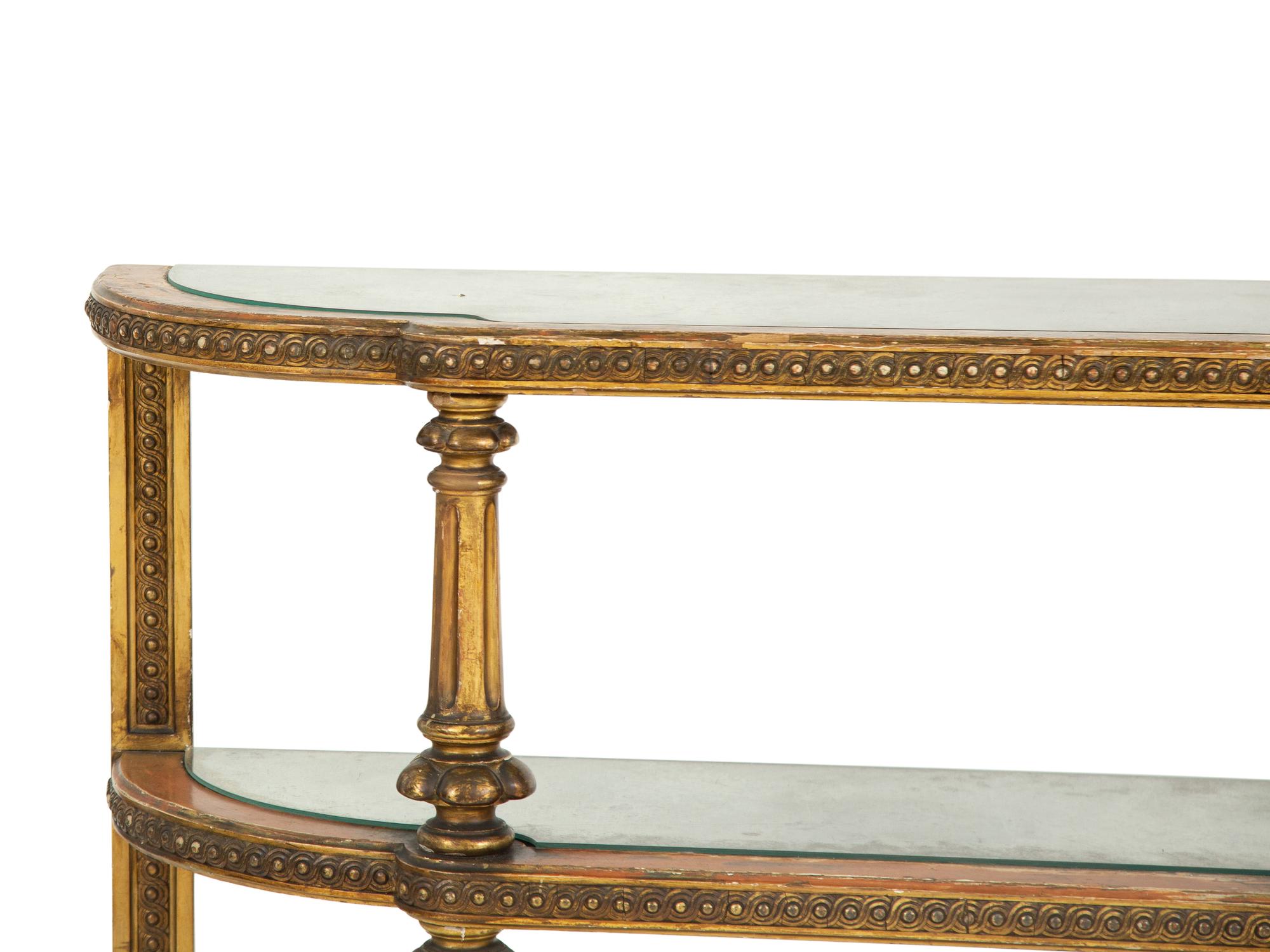 An Italian Carved and Painted Three Tier Etagere Console