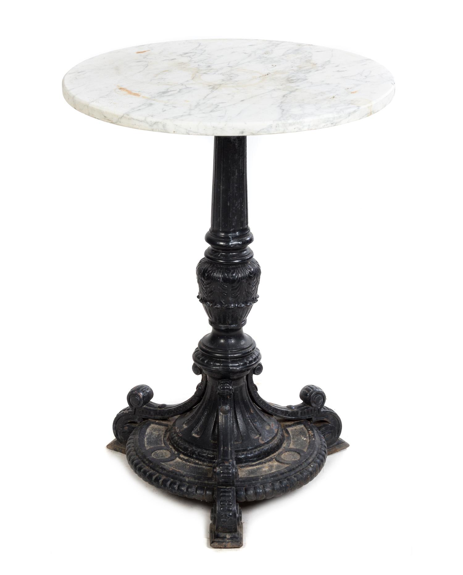 A Cast Iron and Stone Cafe Table Height 30 x diameter of top 22 1/2 inches.