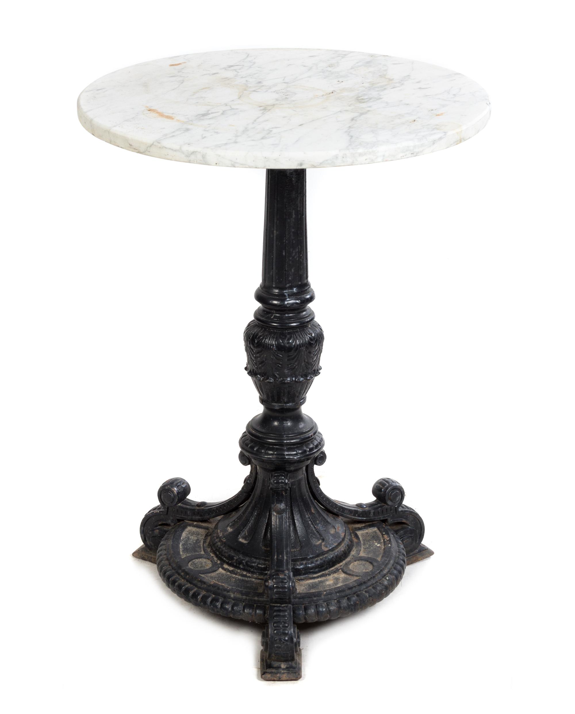 A Cast Iron and Stone Cafe Table Height 30 x diameter of top 22 1/2 inches.