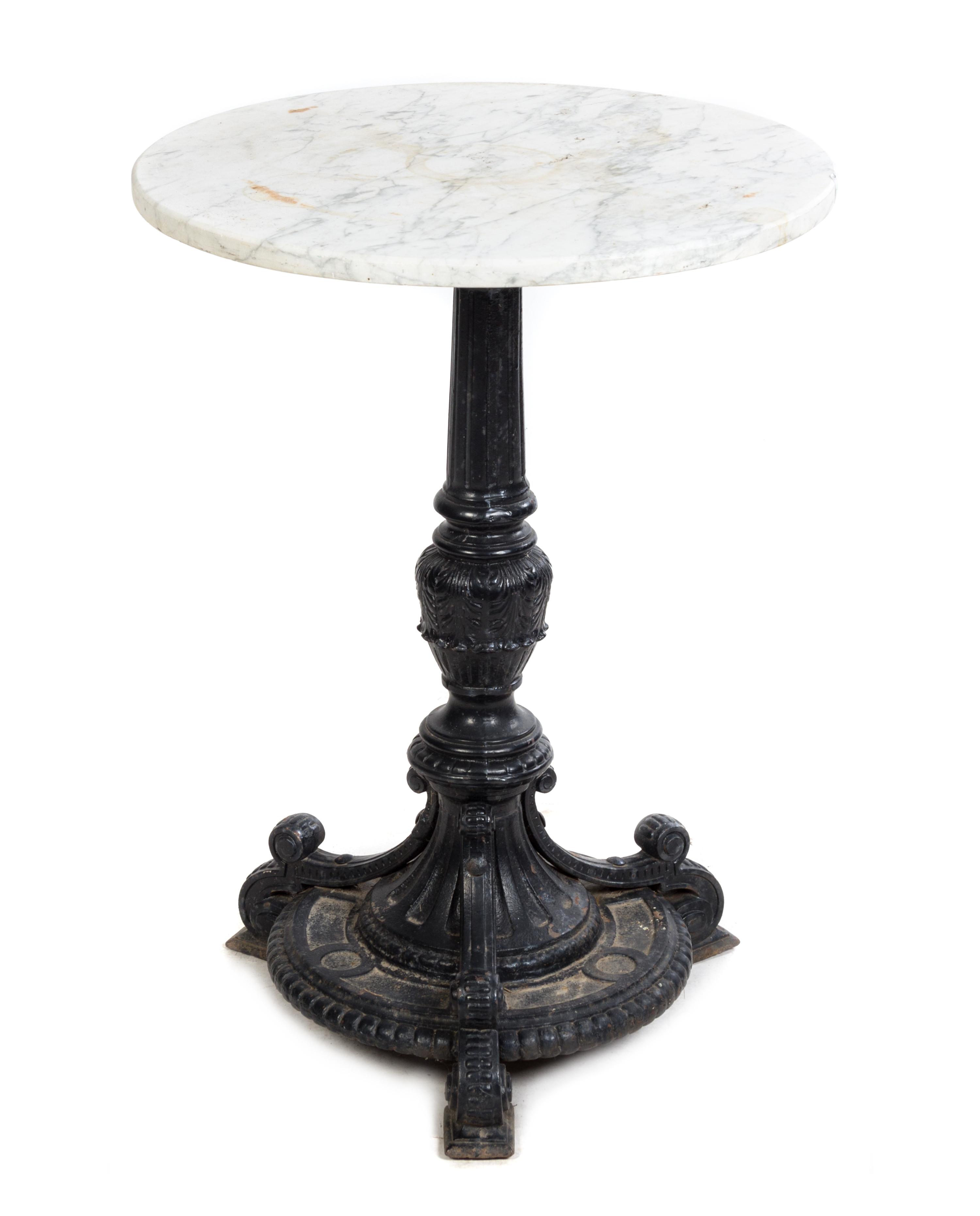 A Cast Iron and Stone Cafe Table Height 30 x diameter of top 22 1/2 inches.