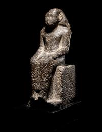 An Egyptian Diorite Seated Figure