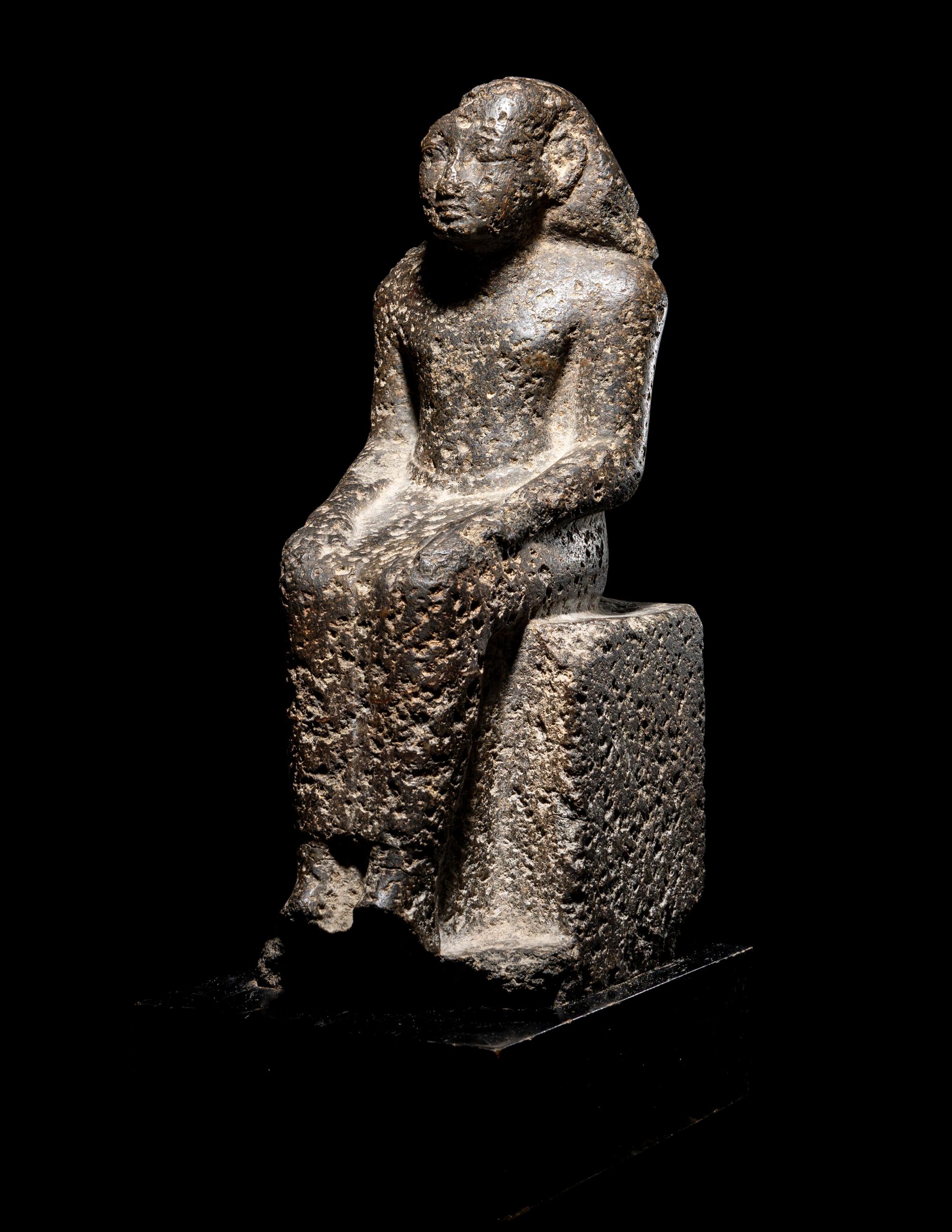 An Egyptian Diorite Seated Figure