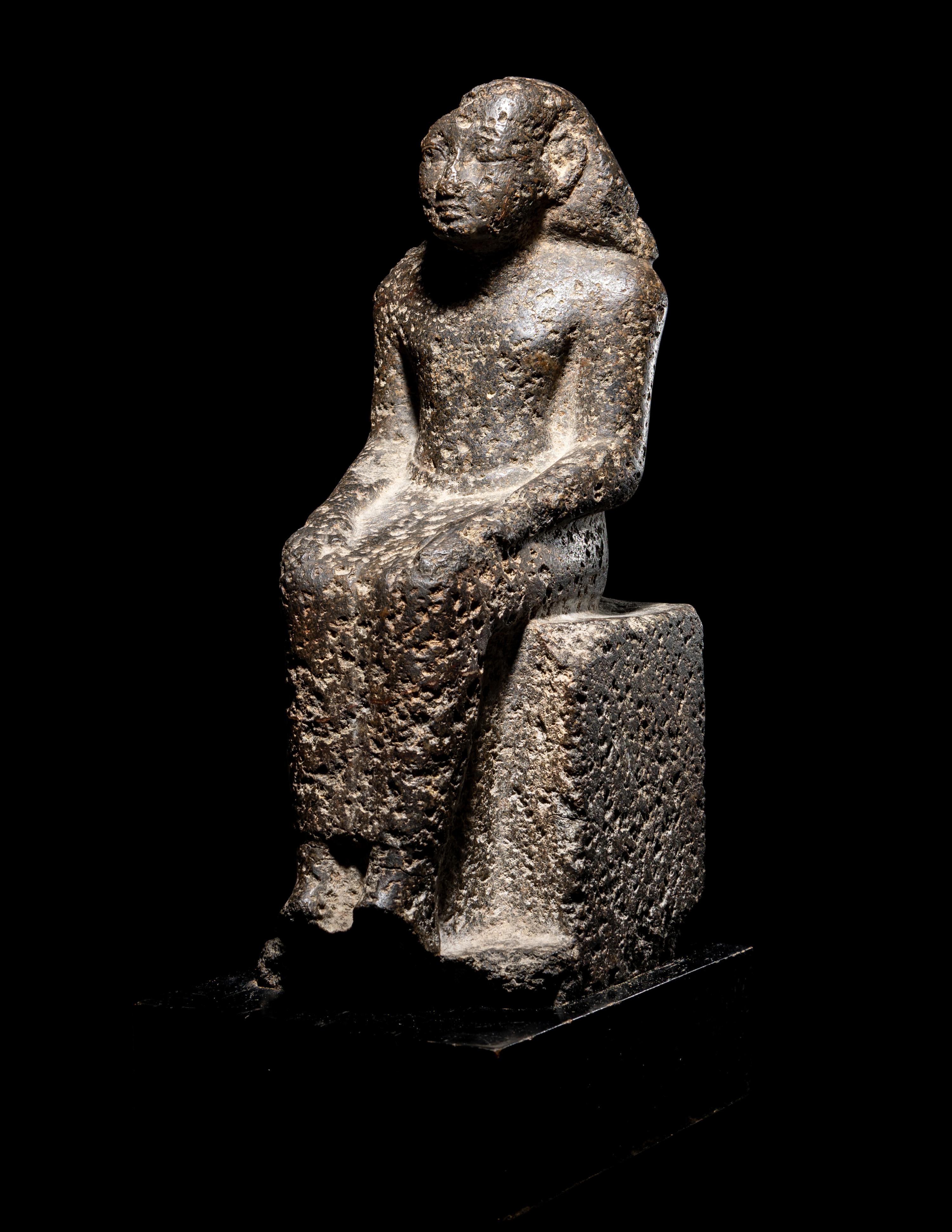 An Egyptian Diorite Seated Figure
