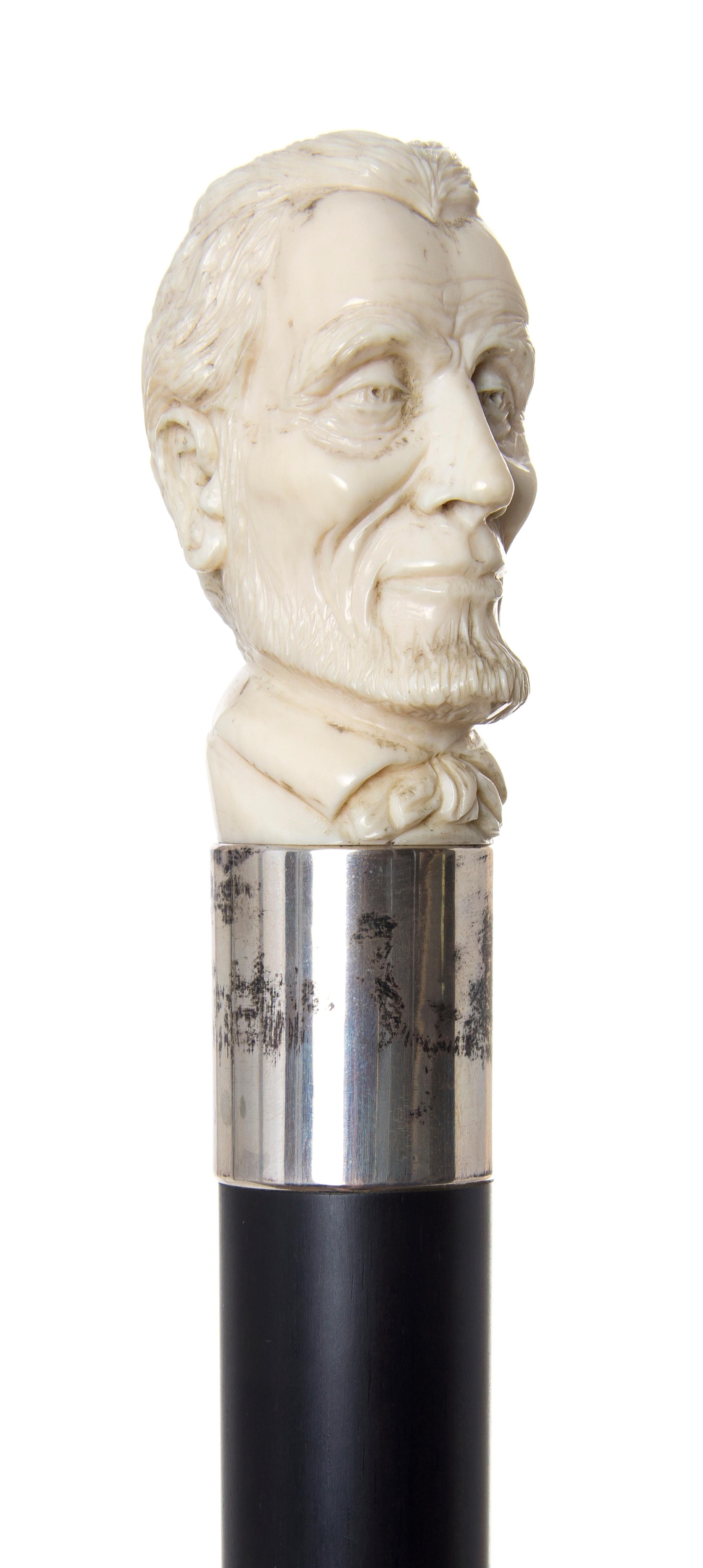 An American Ivory Handled Walking Stick, Length of handle 2 5/8 x length overall 37 inches.