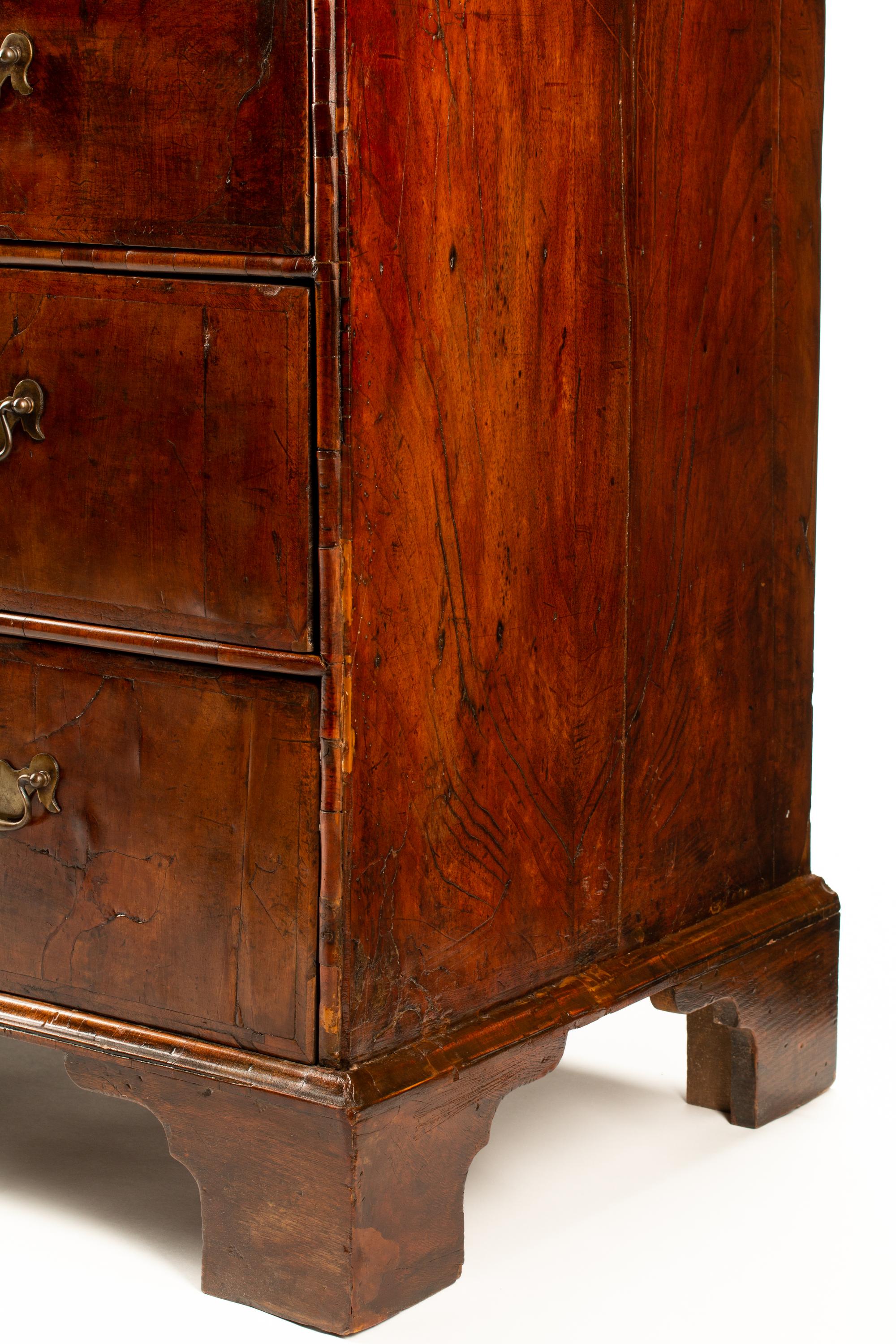 A George II Style Inlaid Walnut Chest of Drawers