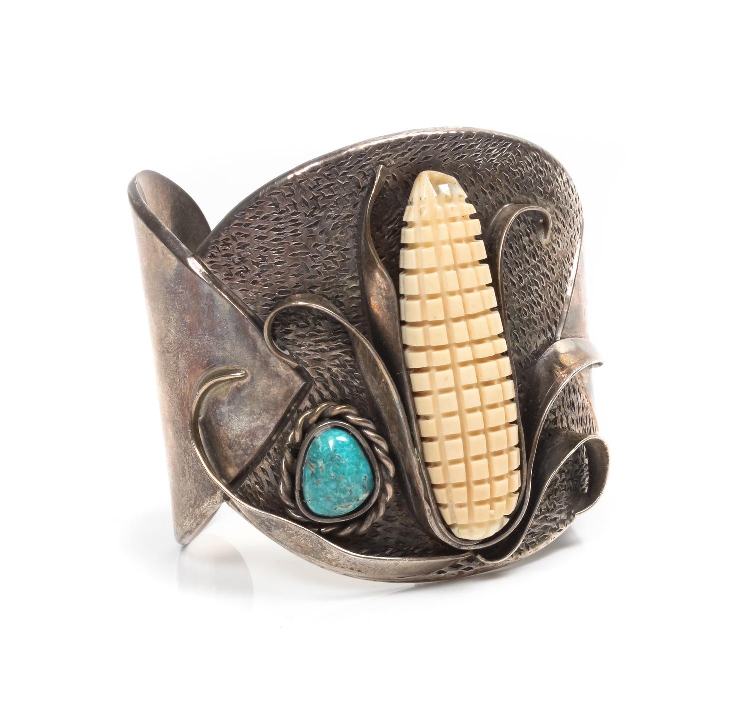 A Southwestern Silver and Turquoise Bracelet and Concho Belt, Buddy Lee Length 5 x opening 1 x width 2 1/4 inches.