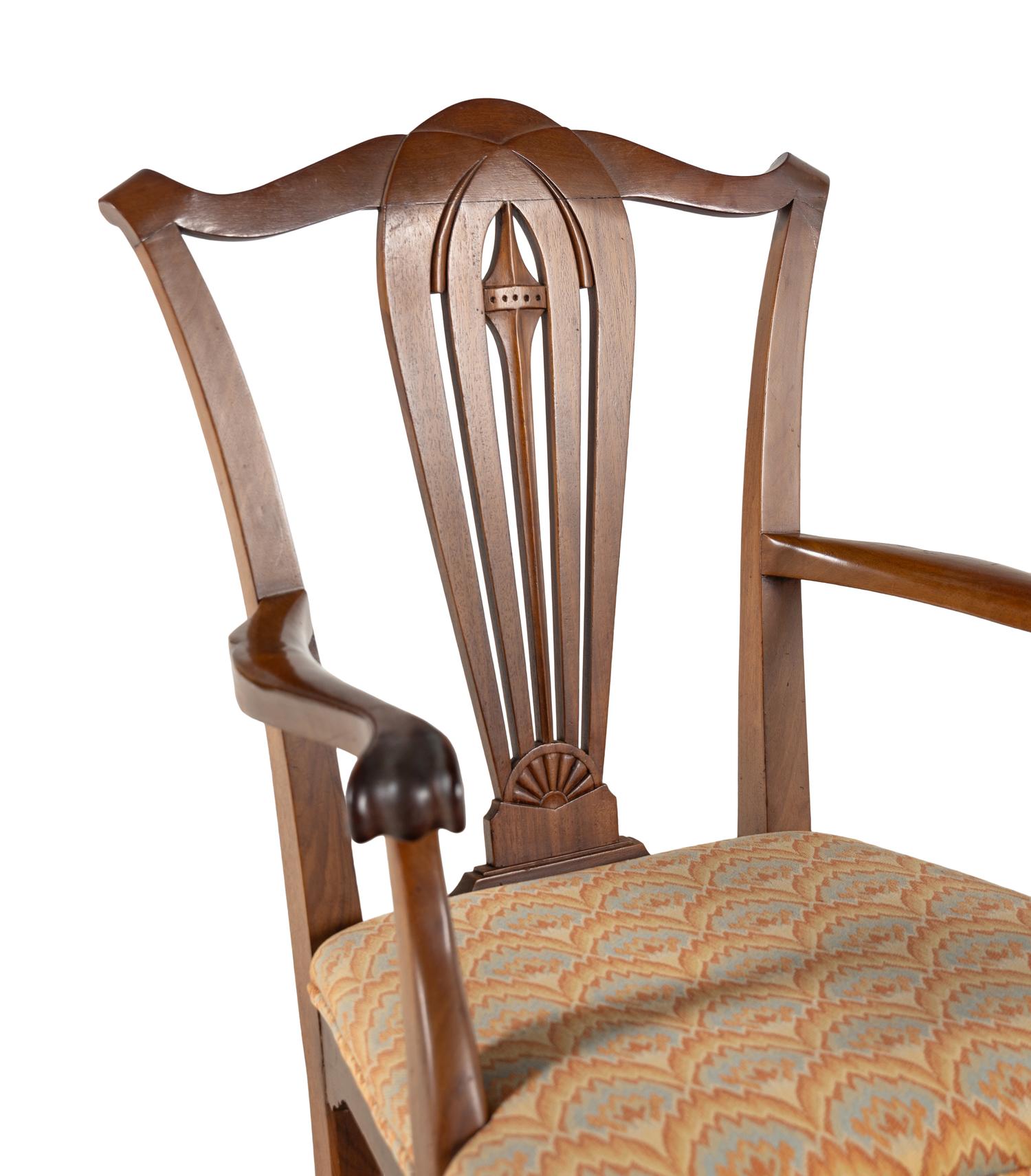 A Set of Seven George III Style Walnut Dining Chairs