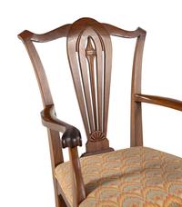 A Set of Seven George III Style Walnut Dining Chairs