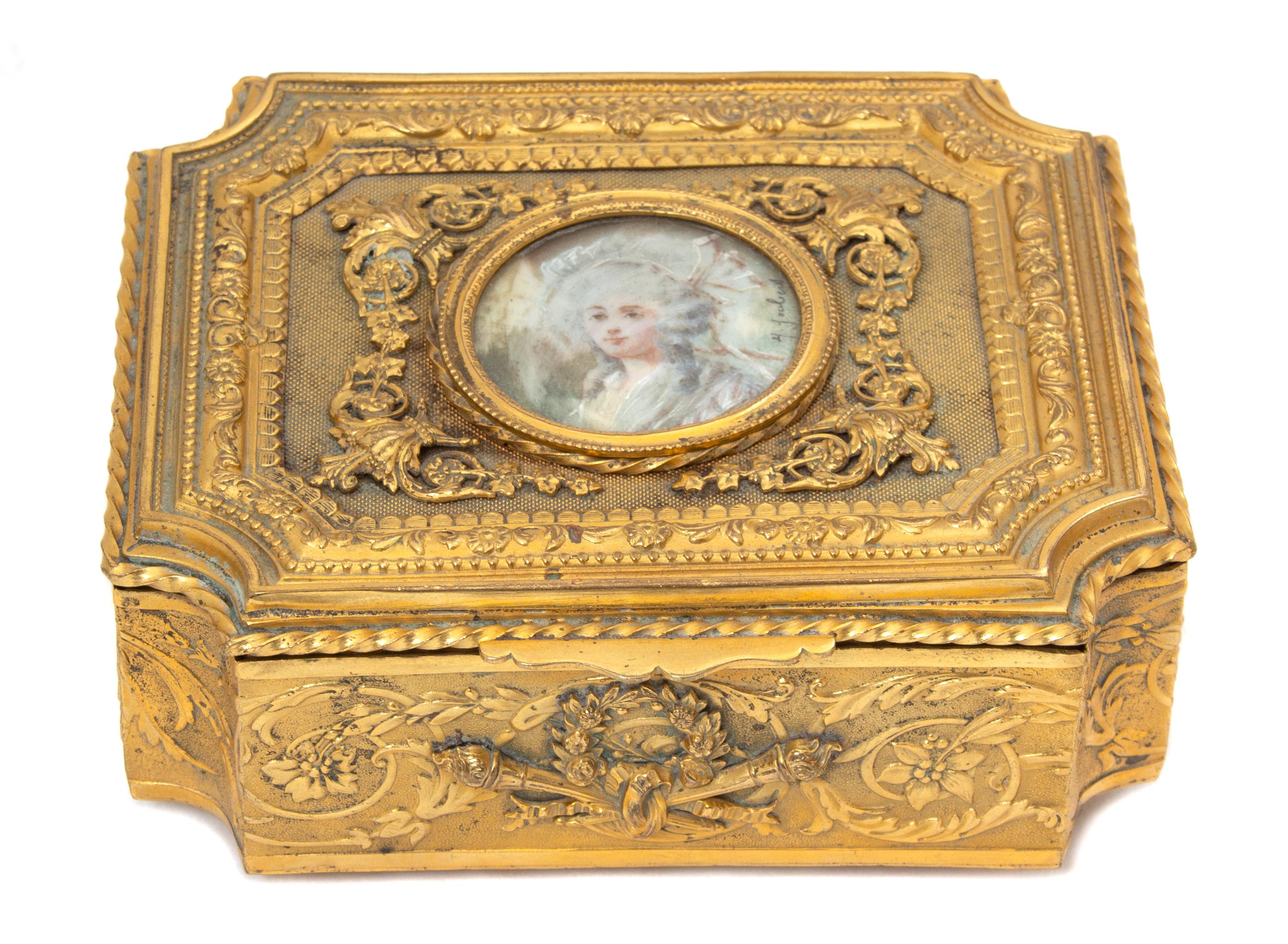 A French Gilt Metal Portrait Jewelry Casket Height 21/4 x width 5 1/8 x depth 4 1/2 inches. — 19TH CENTURY