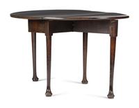 A George III Carved Mahogany Drop-Leaf Table