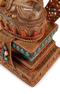 A Tibetan Style Rock Crystal, Gilt Metal Filigree, Turquoise and Carnelian Deity