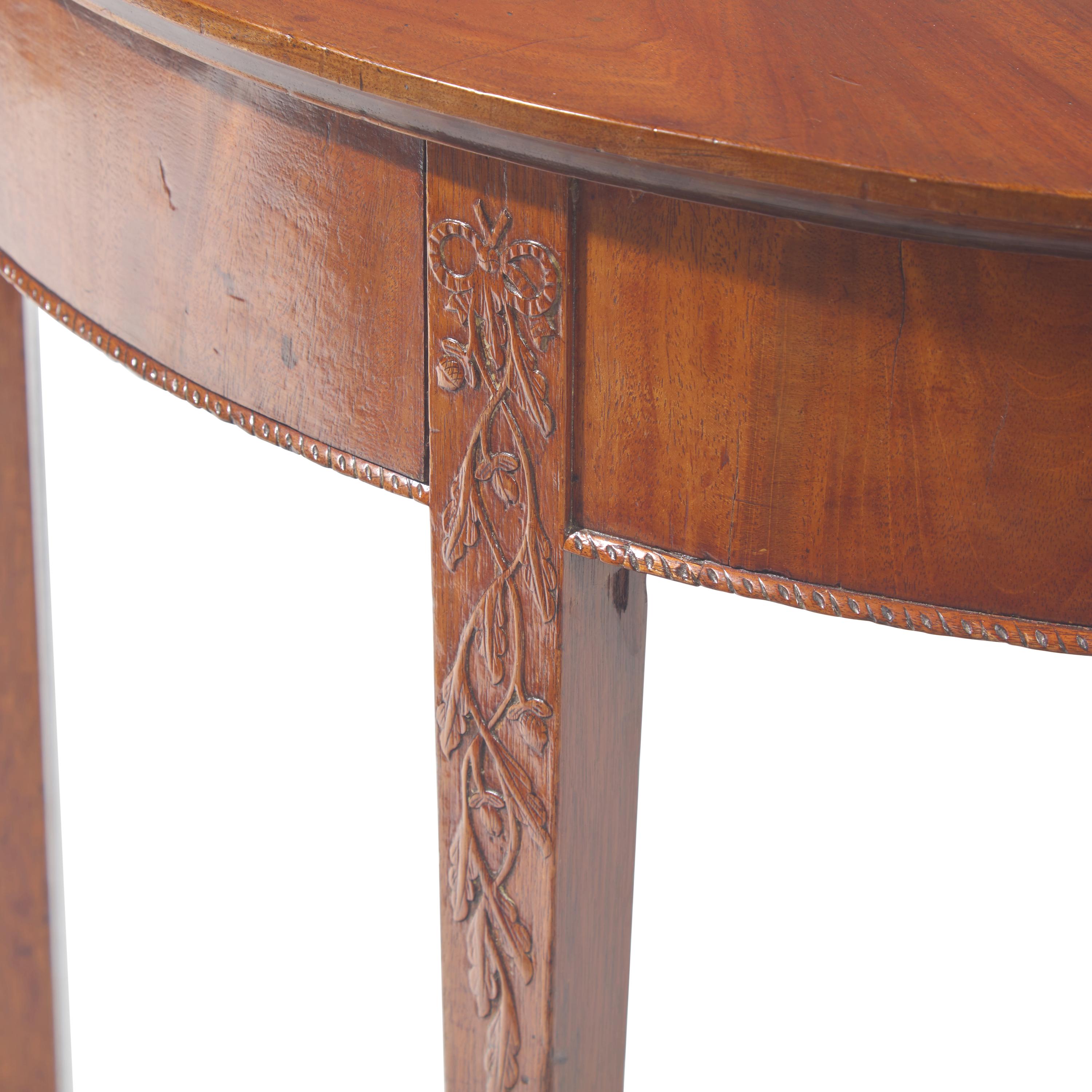 A Federal Carved and Veneered Mahogany Demilune Card Table