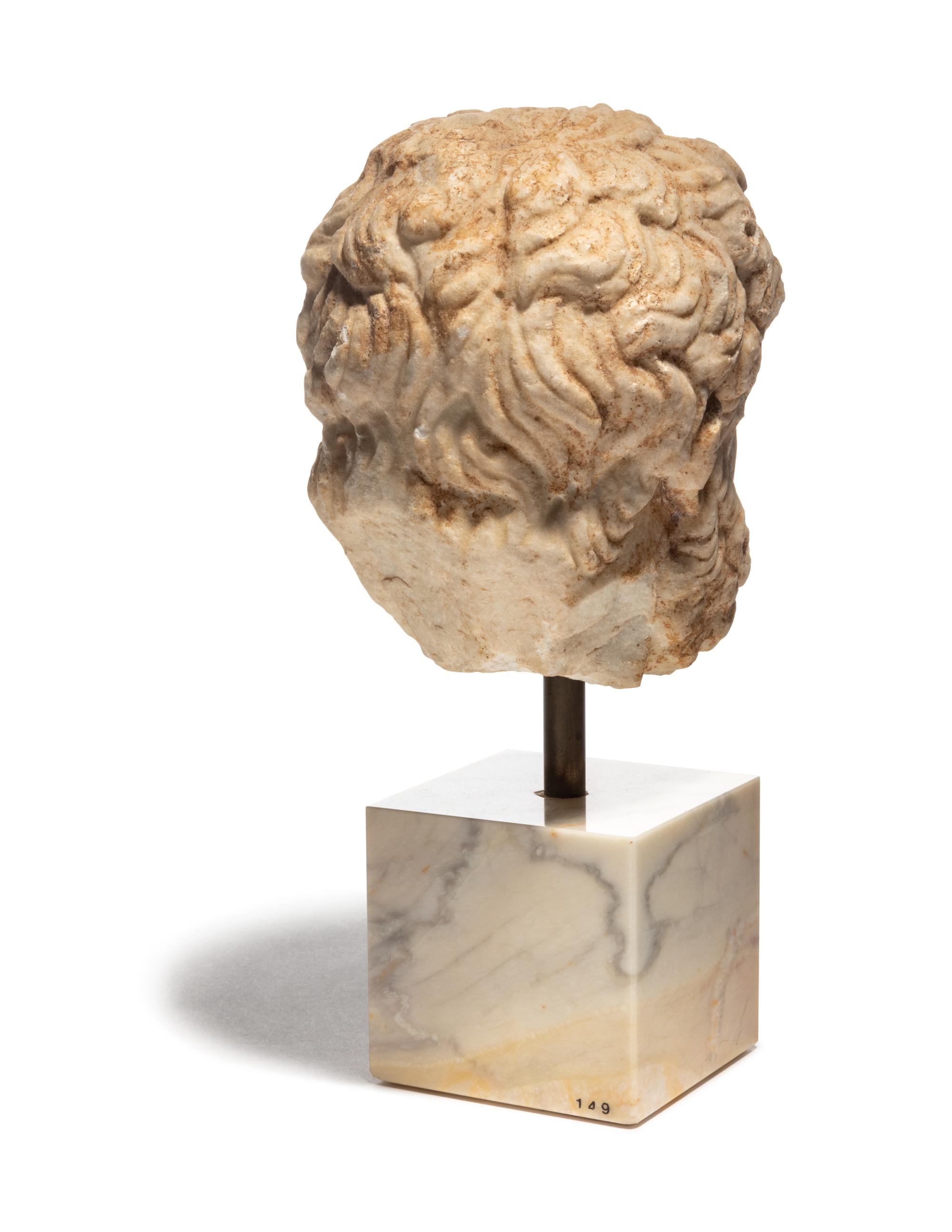 A Roman Marble Head of a Bearded Male, Perhaps Hercules